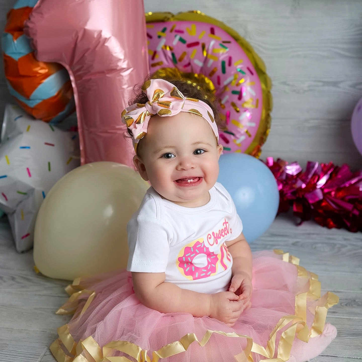 Audrielle is registered to the contest to win money with this photo: accessories, baby, balloon, clothing, costume, cream, dessert, dress, face, food, hat, head, people, person, photography, portrait, purple, sitting, skirt, t_shirt