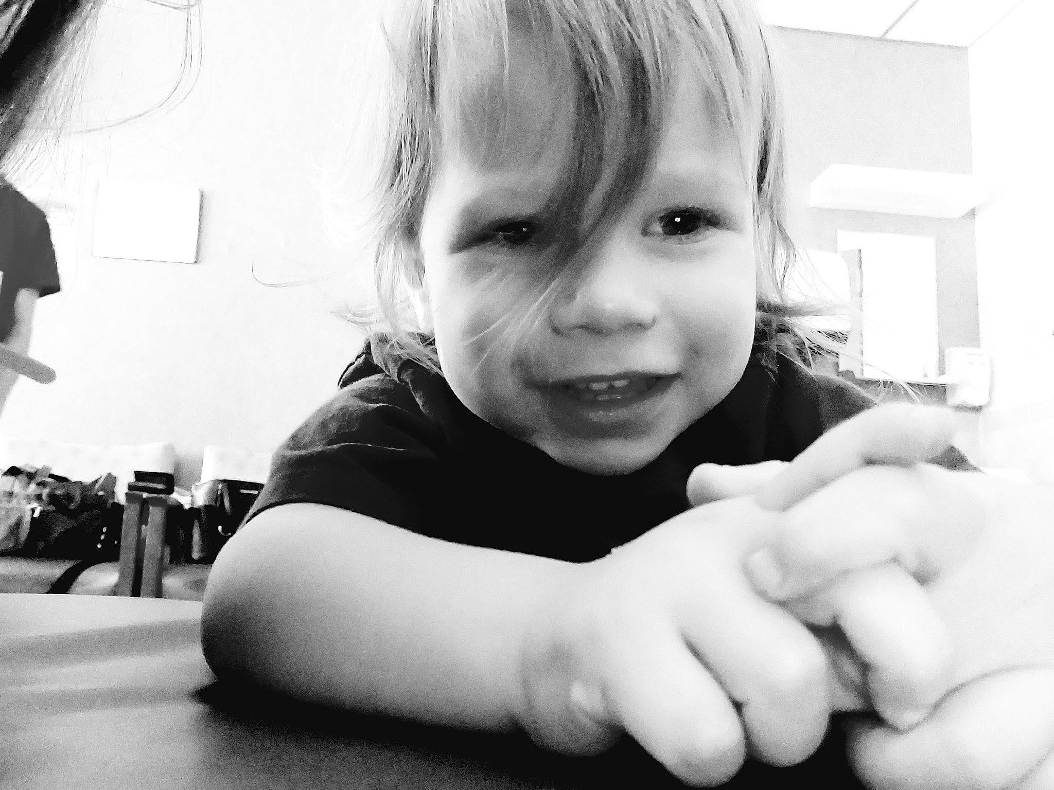 Tyler is registered to the contest to win money with this photo: arm, black_and_white, cheek, elbow, eyelash, face, finger, gesture, hand, happy, human_body, monochrome, monochrome_photography, mouth, nose, person, skin, sleeve, style, thumb