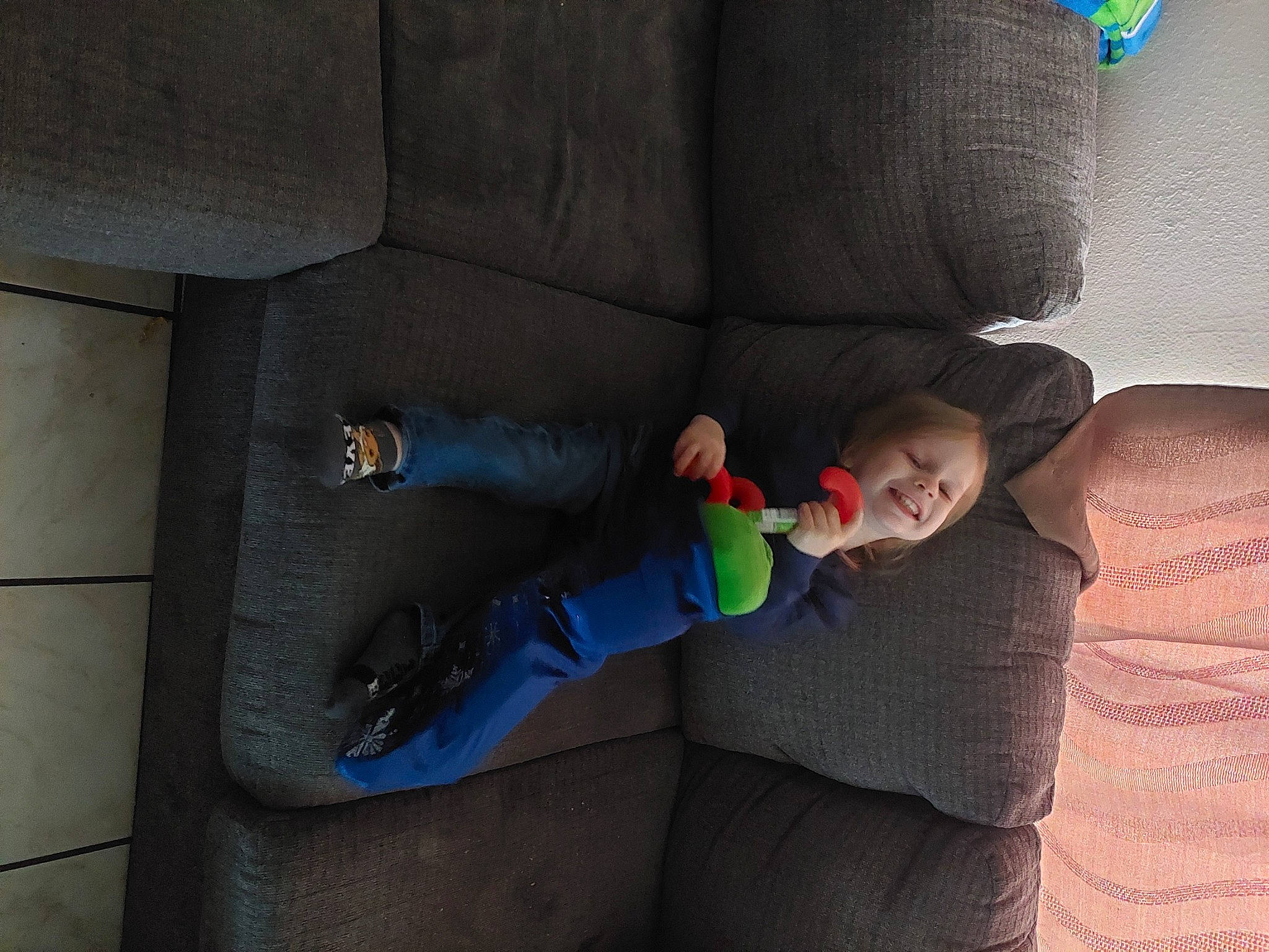 Tyler joined the competition — help win amazing prizes! baby, child, comfort, couch, finger, floor, flooring, foot, fun, human_body, human_leg, joy, knee, lap, leg, linens, nap, person, room, sitting