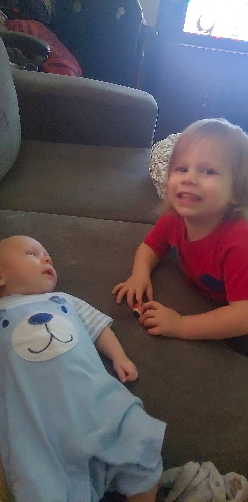 Tyler is registered to the contest to win money with this photo: baby, baby_toddler_clothing, cheek, chin, comfort, couch, facial_expression, fun, gesture, hairstyle, head, human, iris, joy, mouth, nose, person, product, skin, smile