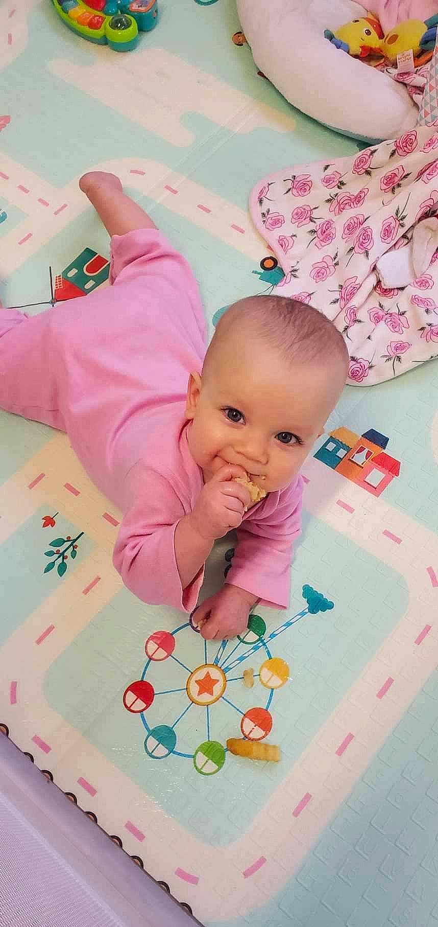 Cassidy joined the competition — help win amazing prizes! baby, baby_products, baby_toddler_clothing, beauty, cheek, child, facial_expression, fun, happy, linens, magenta, pattern, person, pink, play, product, skin, sleeve, snapshot, textile