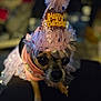 dog, birthday_hat, pink, costume, small_dog, cute, celebration, pet, animal, party, sparkly, tulle, close_up, indoor, decorative, festive, portrait, accessory, blurred_background, chihuahua