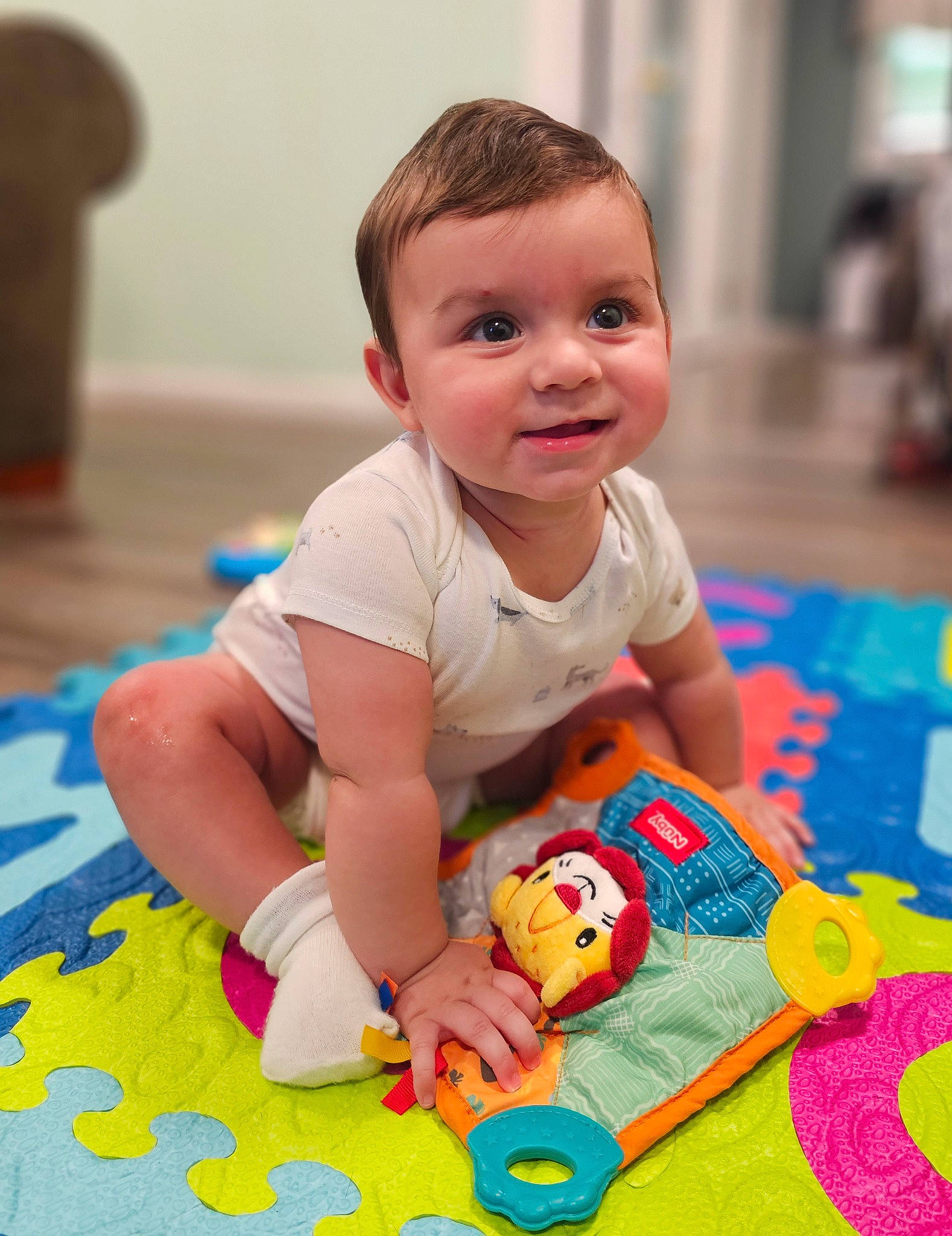 Gabriel is registered to the contest to win money with this photo: baby, baby_playing_with_toys, baby_toddler_clothing, cheek, child, educational_toy, floor, flooring, fun, happy, joy, leisure, person, play, playmat, room, sitting, skin, smile, toddler