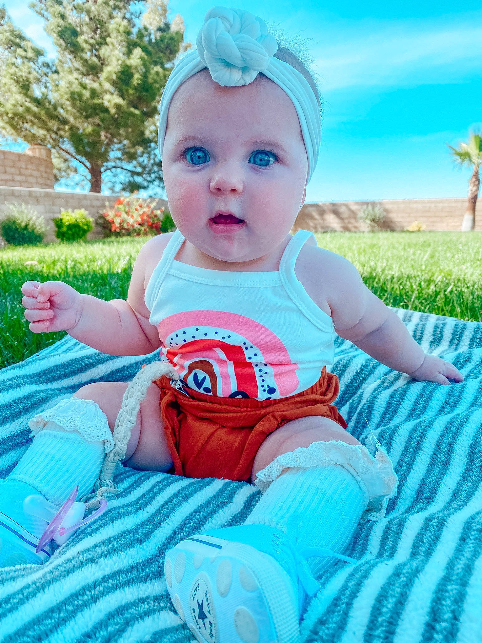 Demi joined the competition — help win amazing prizes! baby, baby_toddler_clothing, blue, cap, child, electric_blue, fun, grass, green, happy, leisure, people_in_nature, person, pink, plant, recreation, skin, sky, summer, surprise