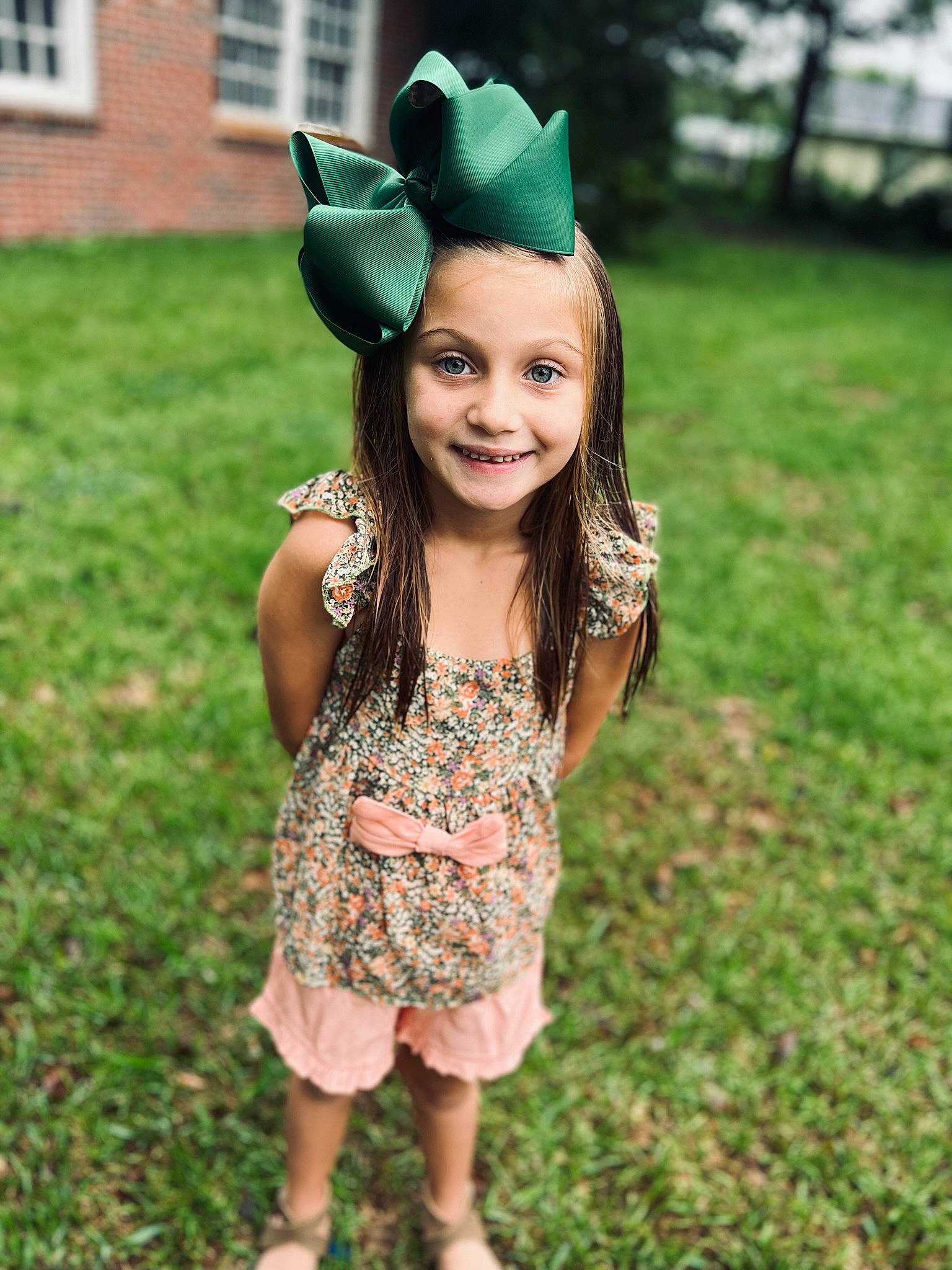 Brynlee is registered to the contest to win money with this photo: dress, eye, fawn, fun, grass, green, hairstyle, happy, head, headgear, headpiece, iris, joy, leaf, people_in_nature, person, pink, plant, smile, toddler