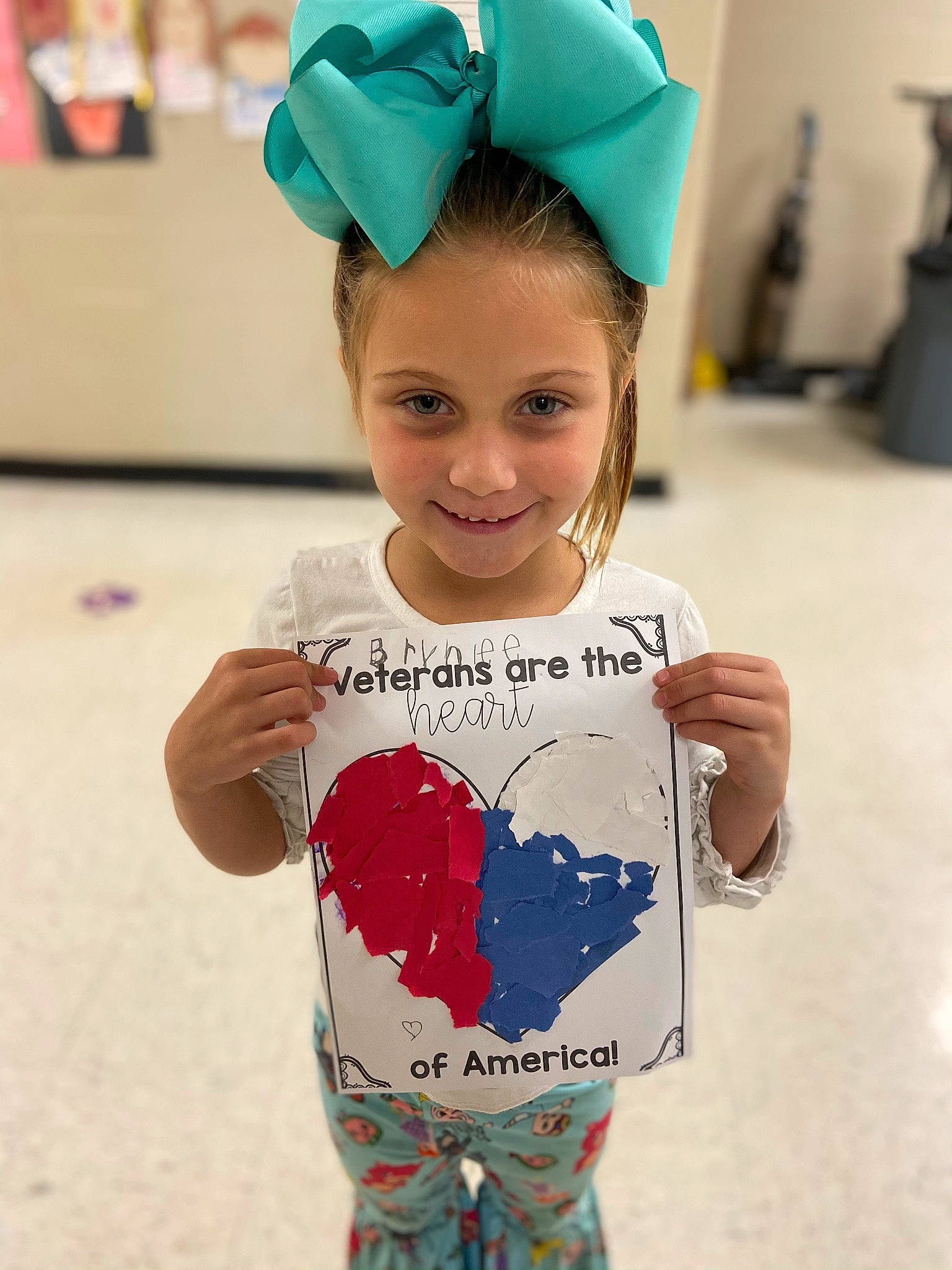 Brynlee is registered to the contest to win money with this photo: blue, cap, child, cool, electric_blue, eye, eyewear, face, fun, hair_accessory, happy, headgear, joy, neck, person, personal_protective_equipment, sleeve, smile, street_fashion, t_shirt