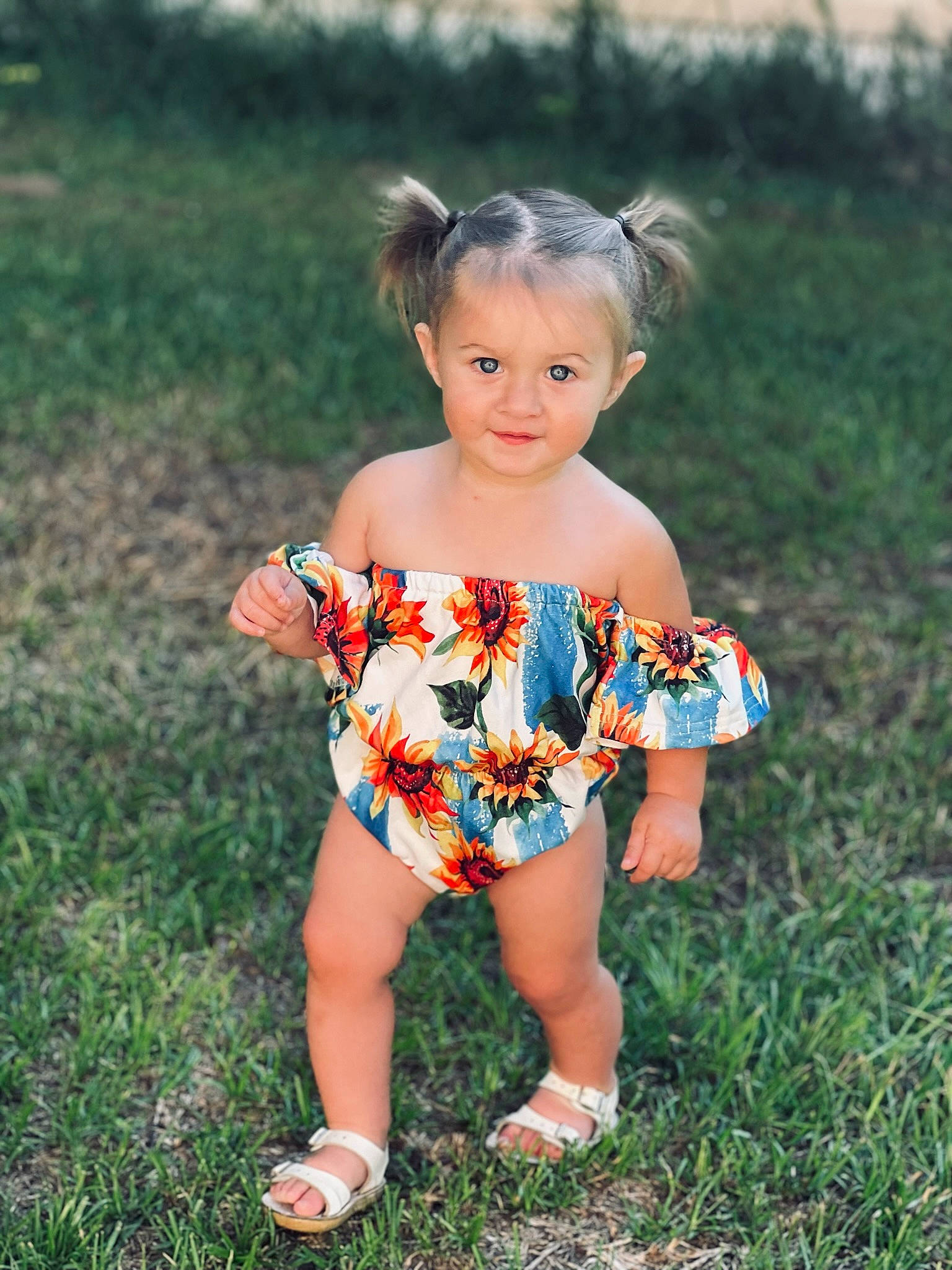 Everleigh joined the competition — help win amazing prizes! baby_toddler_clothing, brown_hair, child, day_dress, dress, electric_blue, fun, grass, grassland, happy, human_leg, leisure, meadow, pattern, people_in_nature, person, plant, sandal, t_shirt, toddler