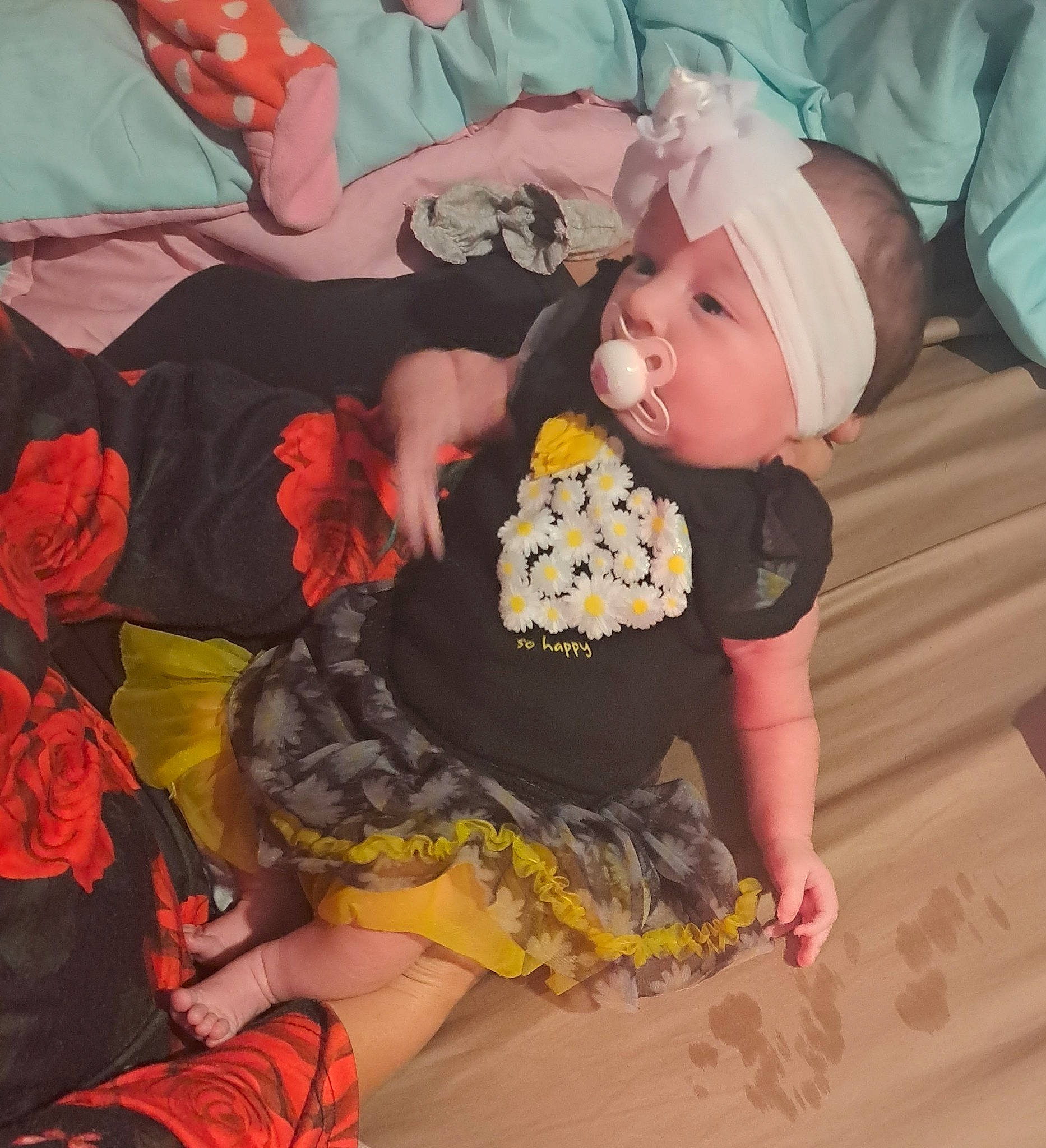 Zeletta is registered to the contest to win money with this photo: baby, baby_products, baby_toddler_clothing, cap, child, costume, fashion_design, fun, hat, headwear, human_leg, lap, pattern, person, pink, room, ruffle, sitting, sleeve, sock