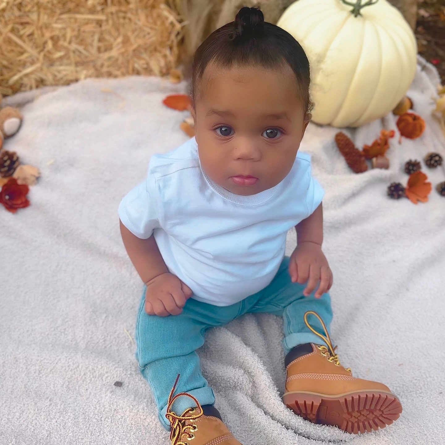 Kynd joined the competition — help win amazing prizes! baby, blanket, clothing, crawling, face, food, footwear, head, jeans, pants, person, photography, plant, portrait, produce, pumpkin, shoe, sitting, toy, vegetable