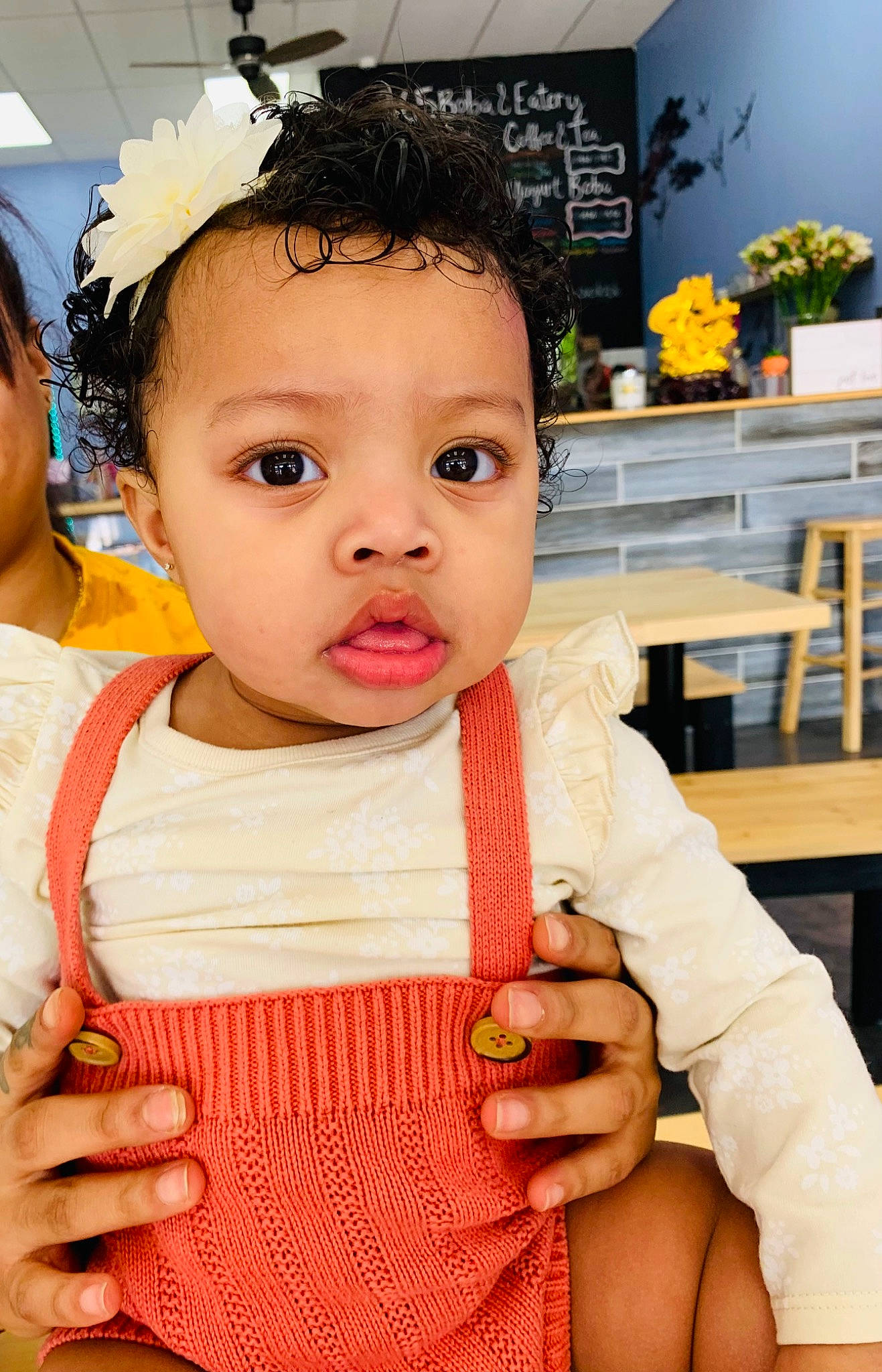 Ammarie is registered to the contest to win money with this photo: baby, baby_toddler_clothing, cheek, dress, event, eyelash, finger, gesture, hand, happy, houseplant, jewellery, lip, person, pink, plant, skin, toddler, vest, white