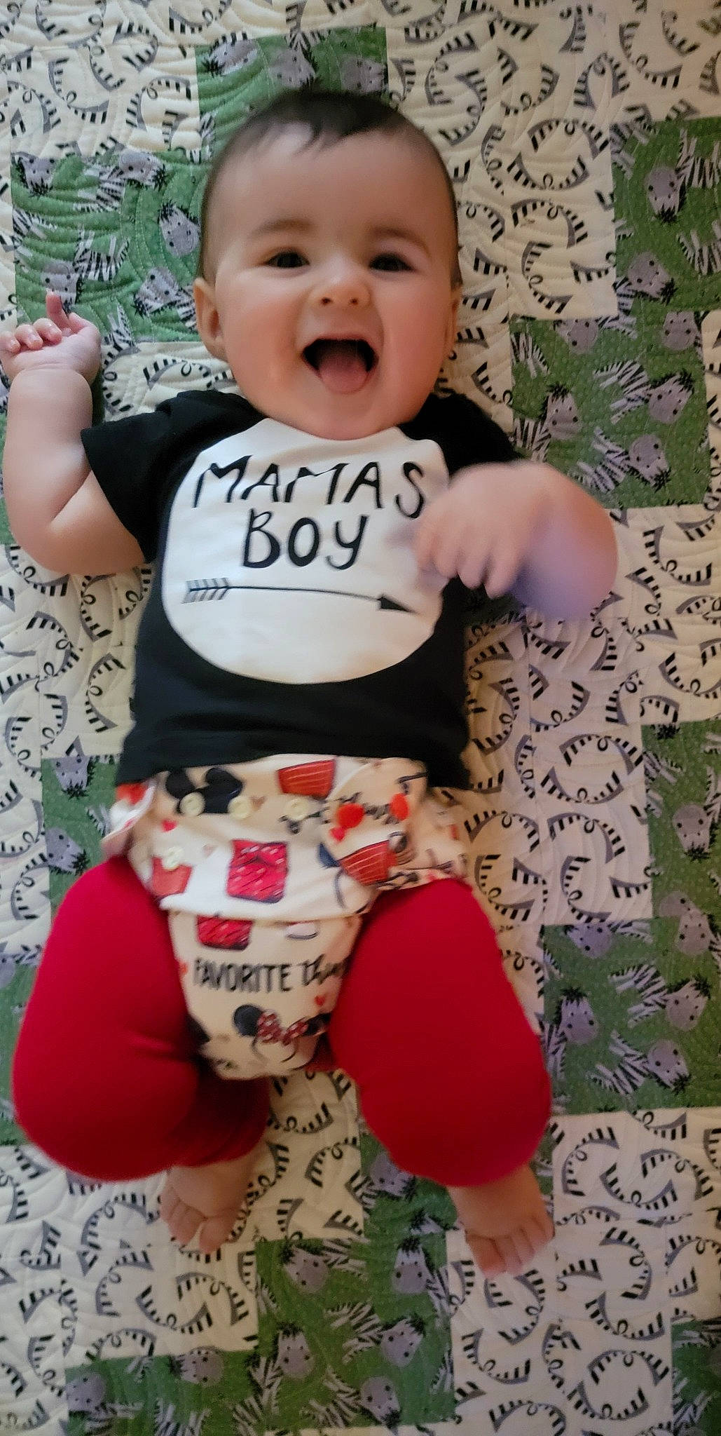 Zaidan is registered to the contest to win money with this photo: active_pants, baby, baby_toddler_clothing, cheek, face, happy, head, pattern, person, pink, skin, sleeve, smile, standing, stomach, t_shirt, textile, toddler, trunk, waist