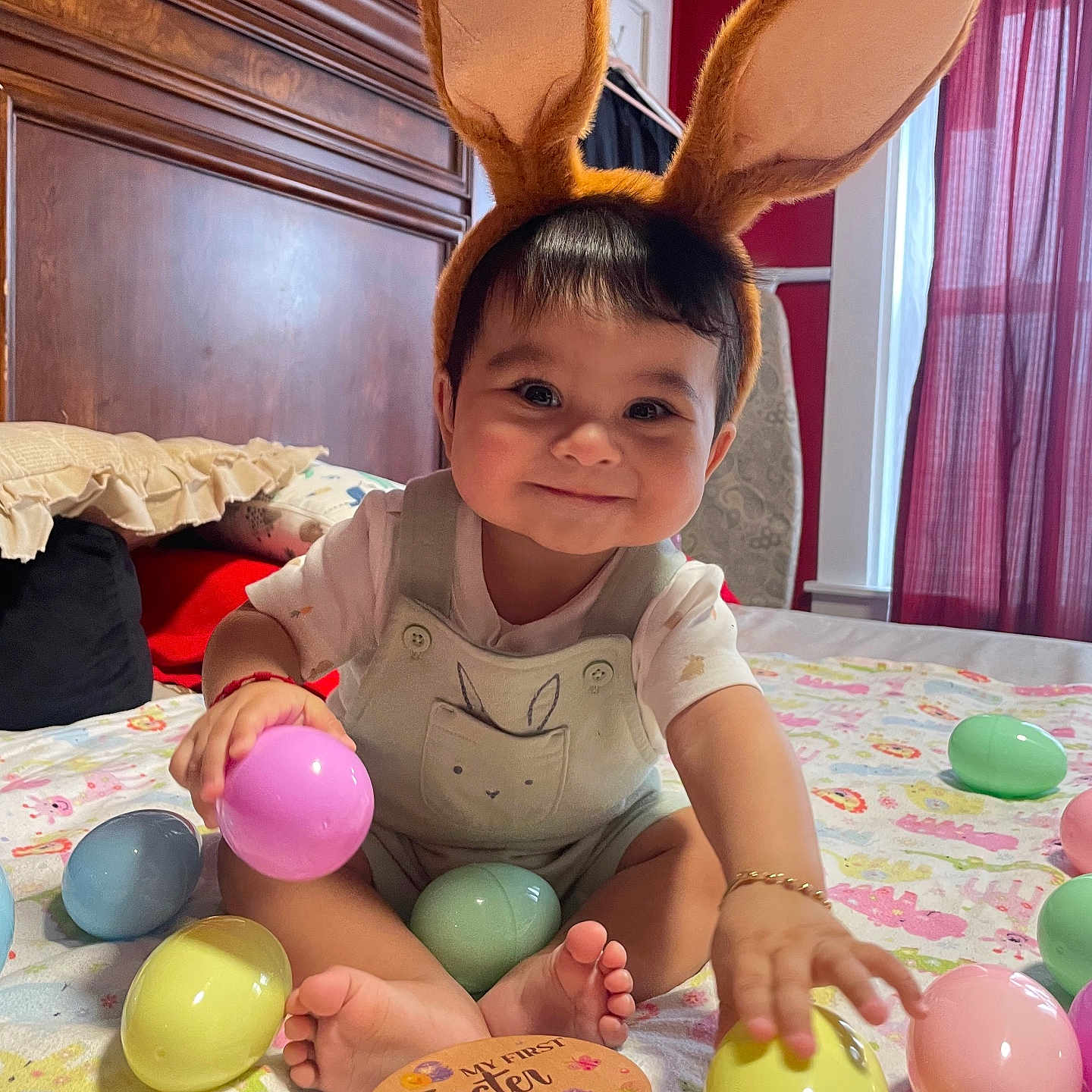 Julian joined the competition — help win amazing prizes! baby, bunny_ears, easter_eggs, bed, blanket, child, cute, smiling, indoors, toy, pastel_colors, holiday, playful, happy, person, young_child, decor, foot, hand, headwear