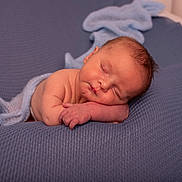Xavi participe au concours pour gagner de l'argent avec cette photo : newborn, baby, sleeping, blue_blanket, knitted_wrap, soft_texture, peaceful, infant, portrait, closeup, skin, resting, cute, child, indoors, cozy, relaxation, small_hands, face, head