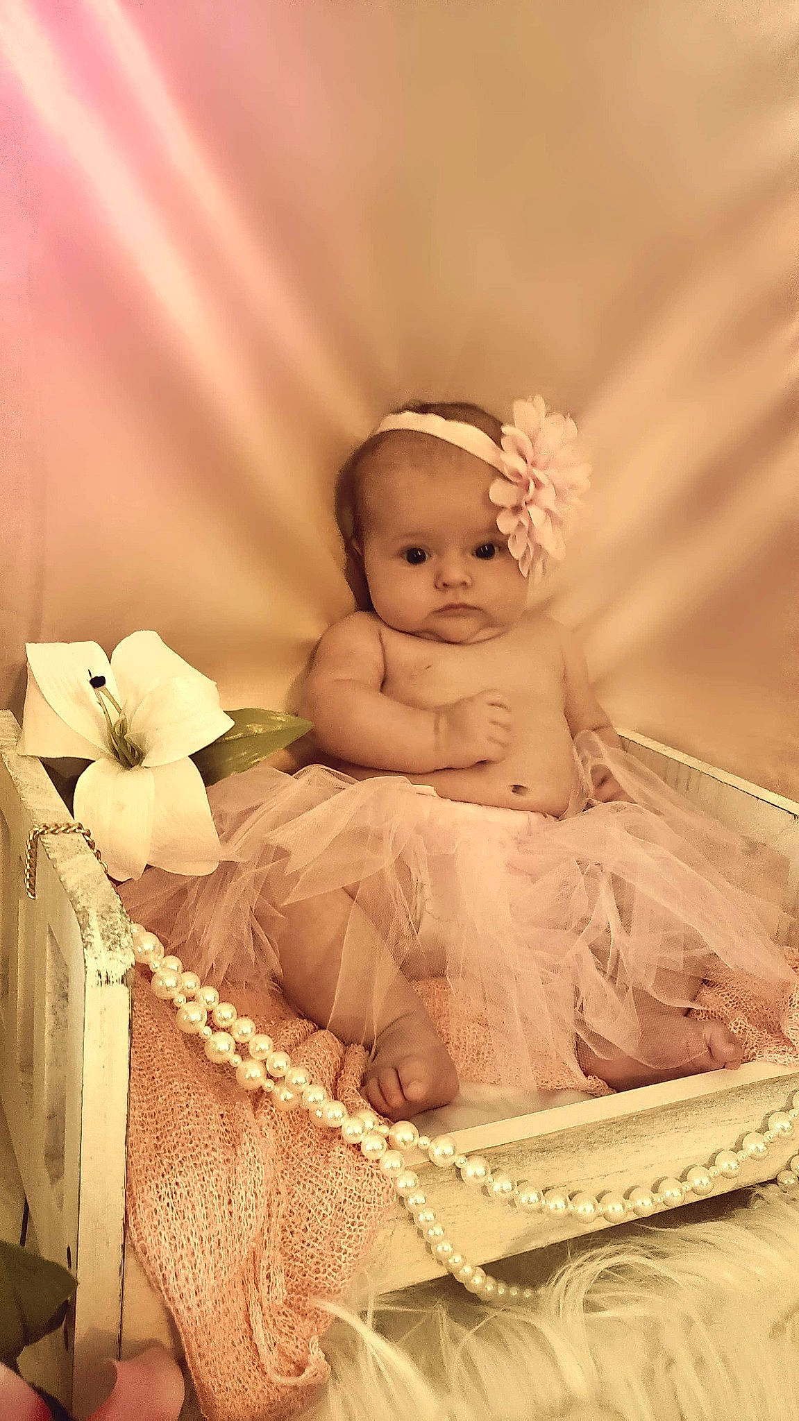 Persephone is registered to the contest to win money with this photo: baby, baby_products, basket, child, hair_accessory, headpiece, infant_bed, person, photography, product, toddler