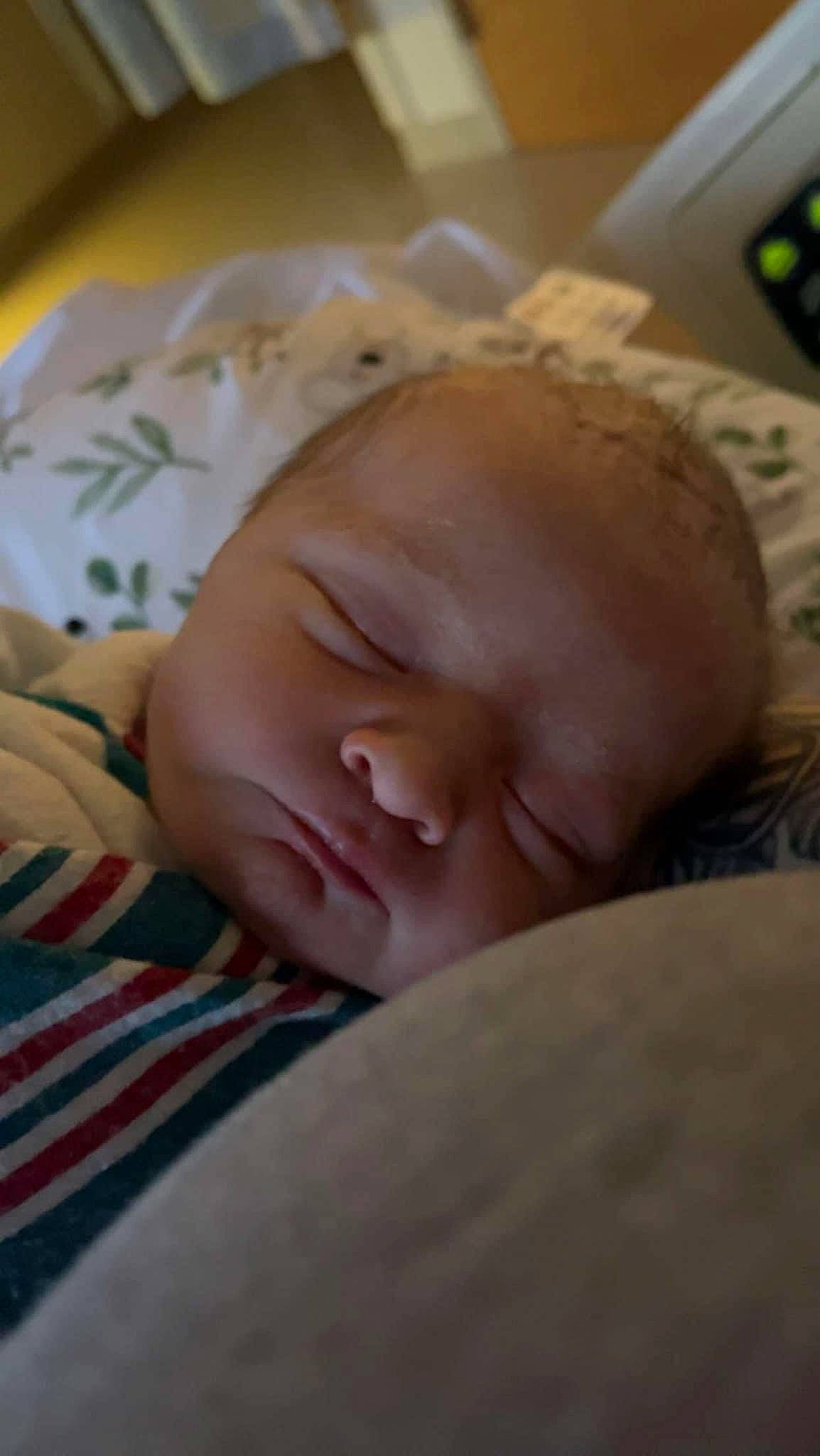 Wynter is registered to the contest to win money with this photo: baby, bedtime, cheek, child, chin, comfort, computer_keyboard, eye, eyebrow, flesh, input_device, linens, nap, nose, person, portrait_photography, remote_control, room, skin, sleep