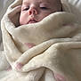 Elsie joined the competition — help win amazing prizes! baby, blanket, face, infant, portrait, sleepy, soft_texture, wrapped, cute, child, warm, cozy, indoors, resting, young, skin, head, expression, comfort, peaceful