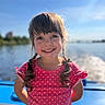 child, girl, smile, braids, pink_dress, polka_dots, outdoor, boat, water, sky, sunlight, portrait, happy, summer, nature, hair, face, person, daylight, expression