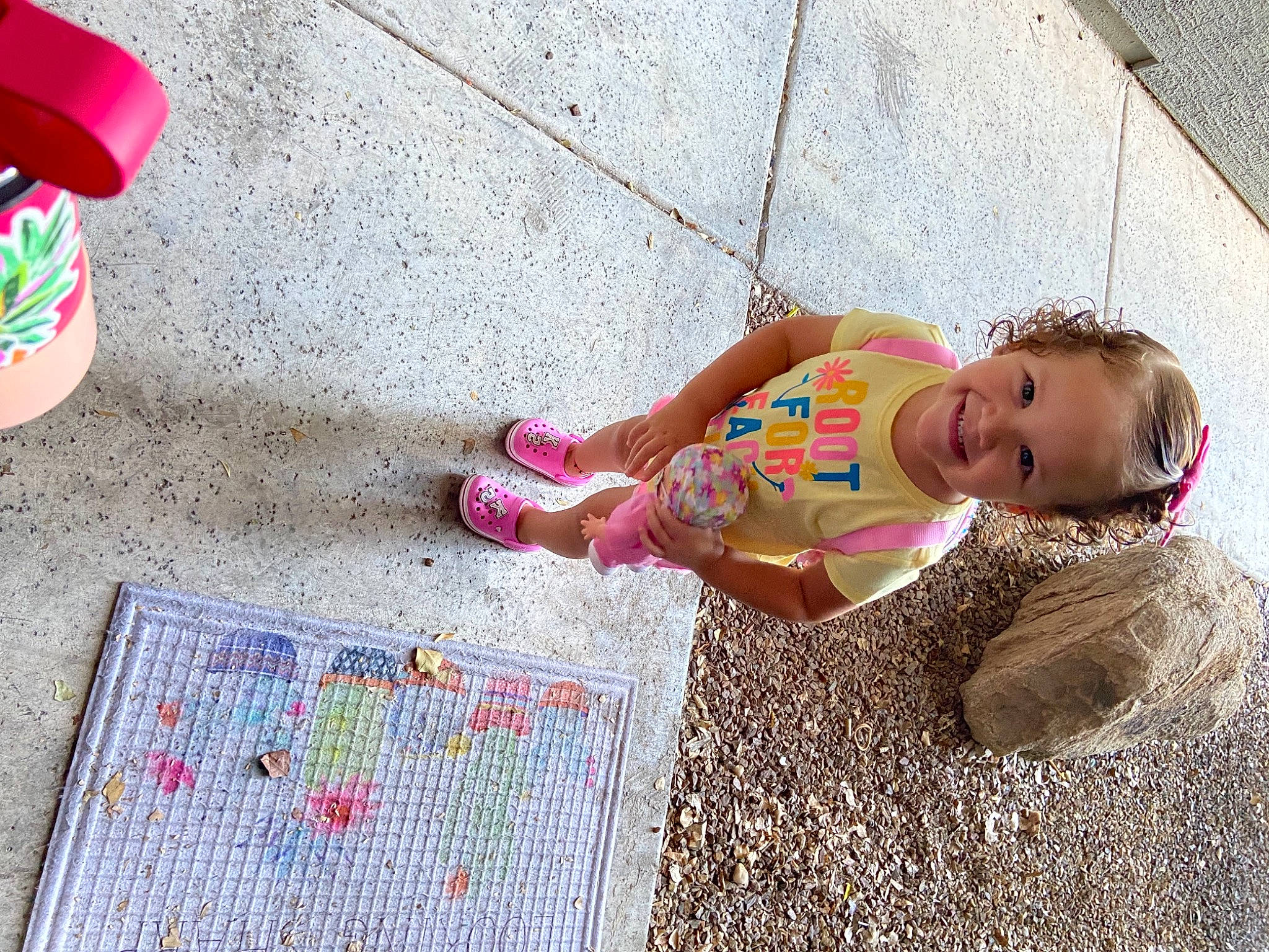 Kenna is registered to the contest to win money with this photo: child, flooring, foot, fun, head, human_leg, human_settlement, joy, leg, leisure, people_in_nature, person, pink, public_space, shoe, sidewalk, summer, sunglasses, thigh, toddler