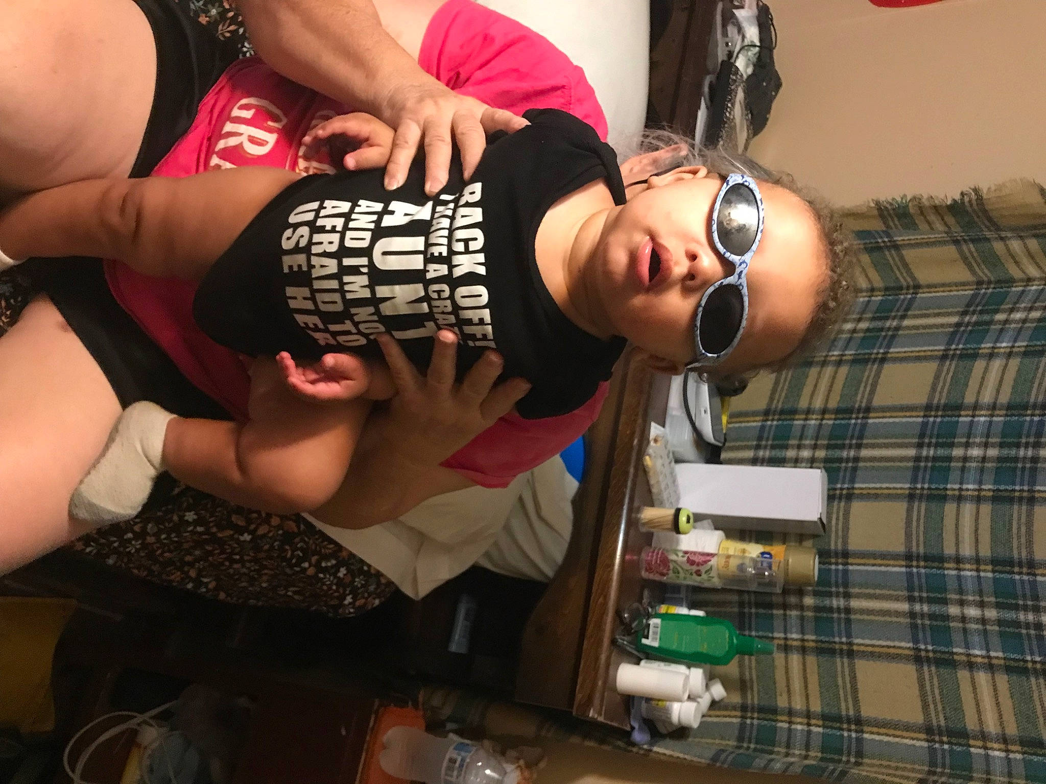 Jordan is registered to the contest to win money with this photo: abdomen, black_hair, elbow, event, eyewear, fashion_design, flash_photography, fun, hat, human_leg, knee, nail, person, plaid, smile, tartan, thigh, trunk, vision_care, waist