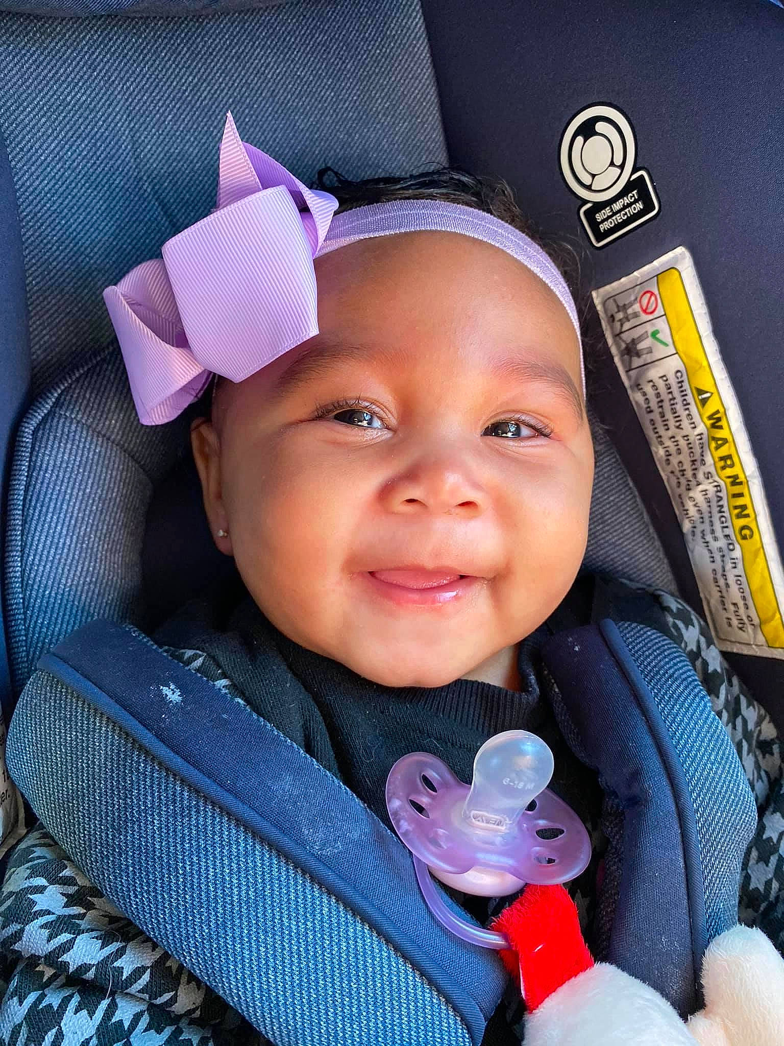 Leilanni joined the competition — help win amazing prizes! baby, baby_carriage, baby_toddler_clothing, cheek, eye, eyebrow, face, happy, head, headwear, iris, lip, nose, organ, person, pink, purple, skin, smile, textile