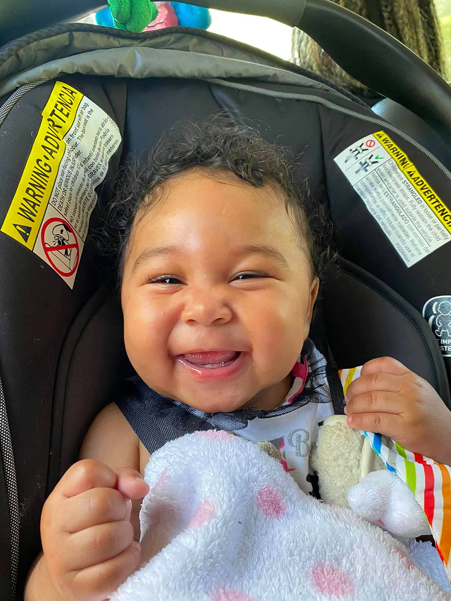 Leilanni joined the competition — help win amazing prizes! car_seat, cheek, child, comfort, cool, eye, eyebrow, finger, fun, gesture, happy, head, nose, person, product, skin, smile, textile, thumb, toddler
