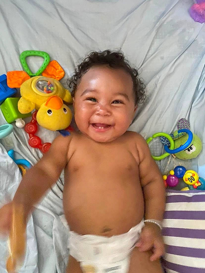 Leilanni joined the competition — help win amazing prizes! abdomen, baby, baby_products, cheek, chest, child, event, eye, face, facial_expression, finger, fun, happy, joy, linens, people, person, skin, smile, textile