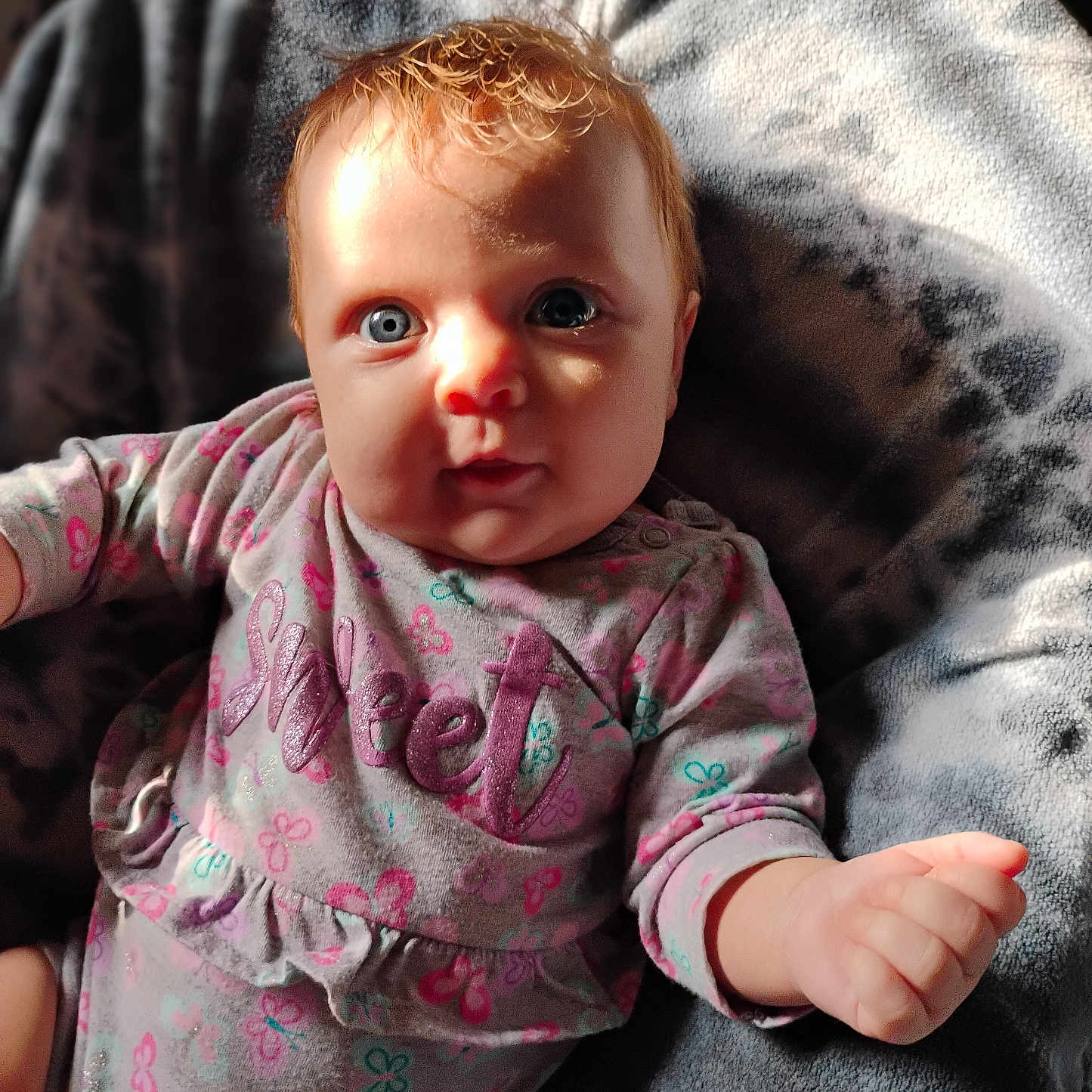 Lisa Jean joined the competition — help win amazing prizes! baby, bodypart, clothing, couch, face, finger, furniture, hand, happy, head, knitwear, longsleeve, mouth, newborn, person, photography, portrait, sleeve, smile, sweater