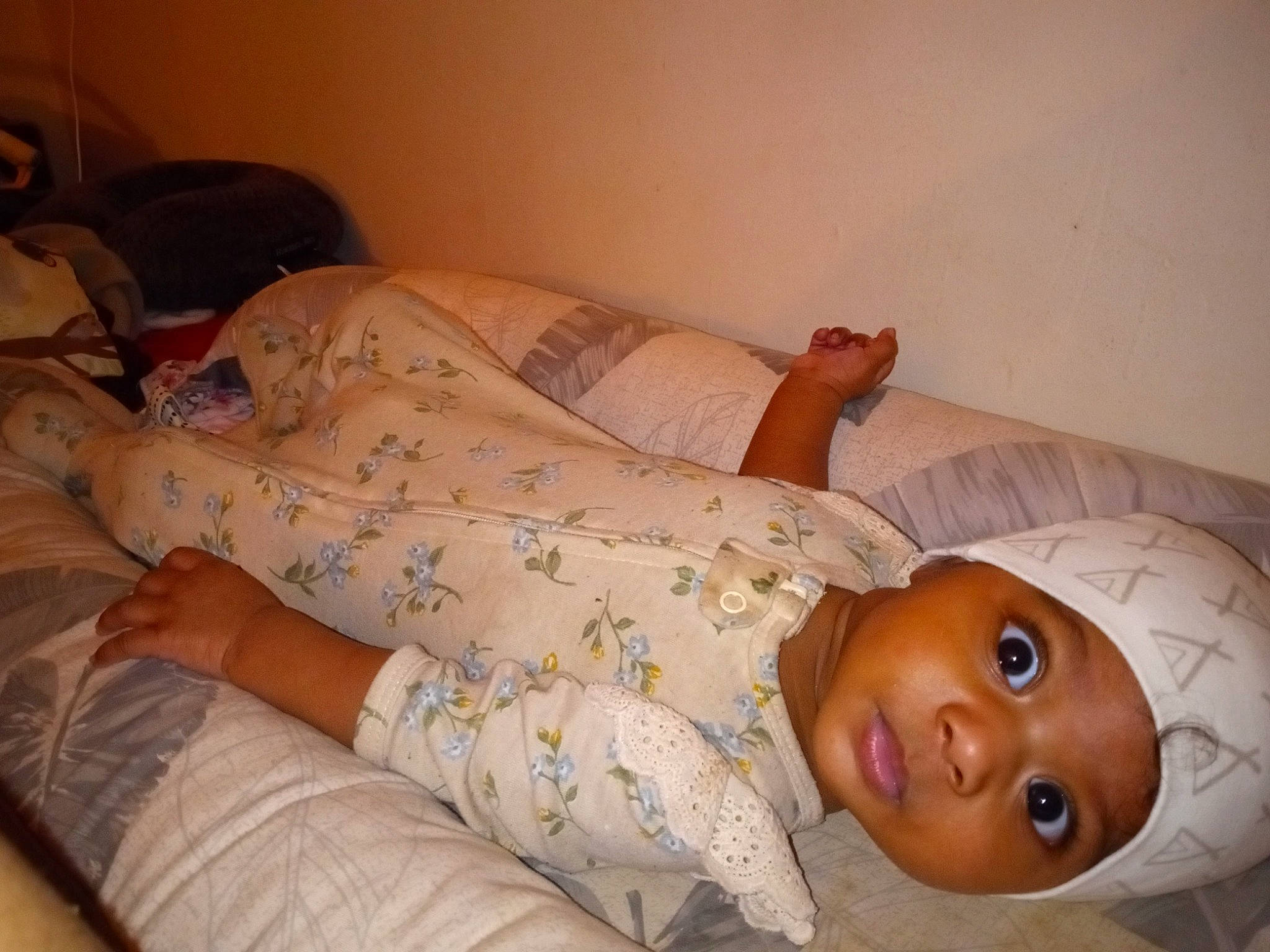 Kendra is registered to the contest to win money with this photo: baby, baby_safety, baby_sleeping, baby_toddler_clothing, bed, bedding, bedtime, child, comfort, duvet, flesh, flooring, head, headwear, human_leg, linens, person, room, skin, sleeve