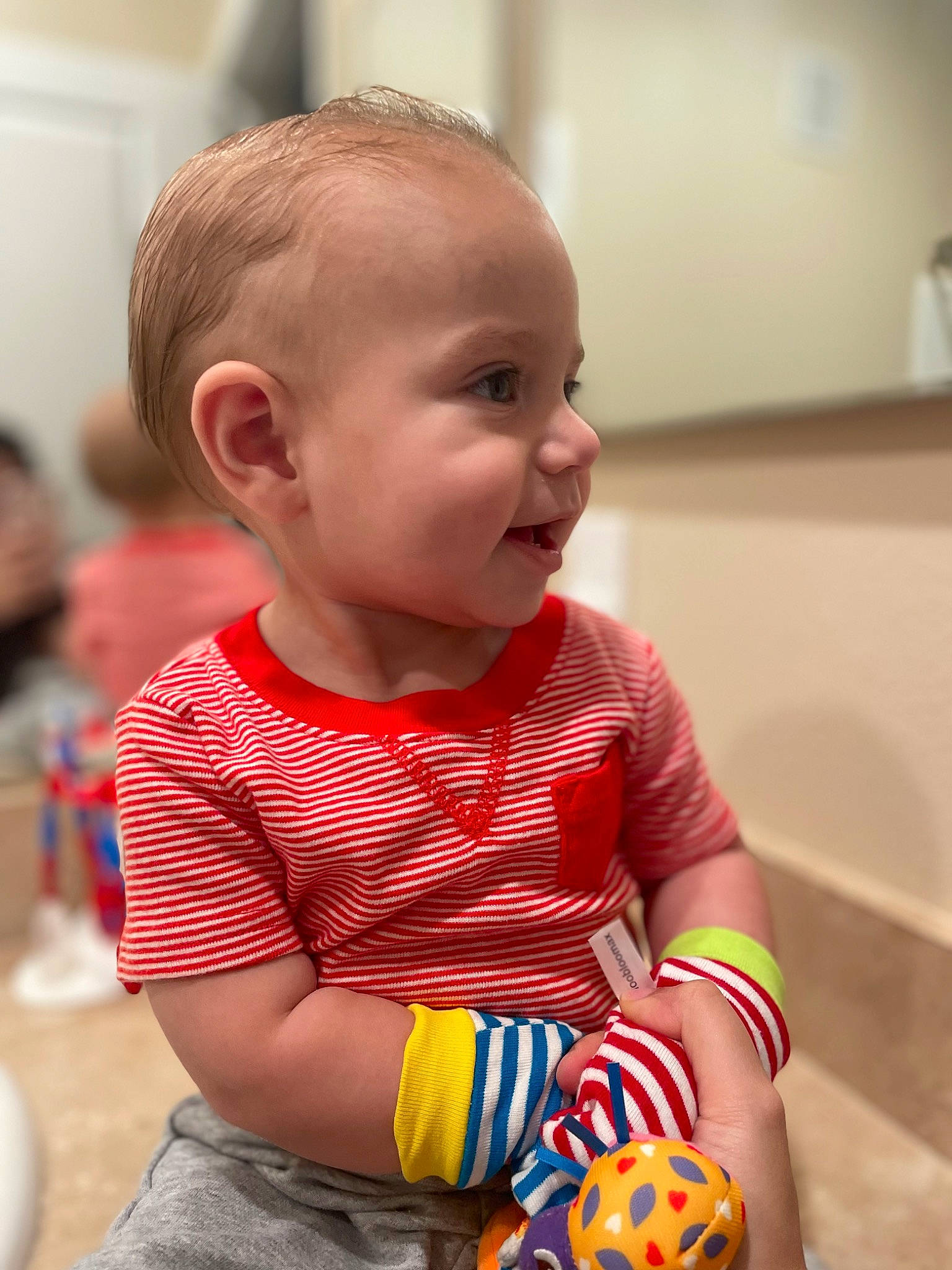 Connor is registered to the contest to win money with this photo: baby, baby_playing_with_toys, baby_toddler_clothing, cheek, child, fun, hairstyle, happy, head, iris, nose, orange, pattern, person, plaid, sitting, skin, sleeve, smile, t_shirt