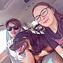 Duke joined the competition — help win amazing prizes! car, dog, people, glasses, sunglasses, smile, seat, interior, happy, tongue_out, casual, young_adult, seatbelt, sunlight, friendship, pet, leather_seat, short_sleeve, hair, vehicle