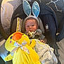 Grayson is registered to the contest to win money with this photo: baby, blanket, blue, bunny_ears, car_seat, checkered_pattern, child, comfort, cute, fabric, headwear, indoors, infant, pacifier, plush_toy, seatbelt, soft_toy, toy, yellow_duck, young_child