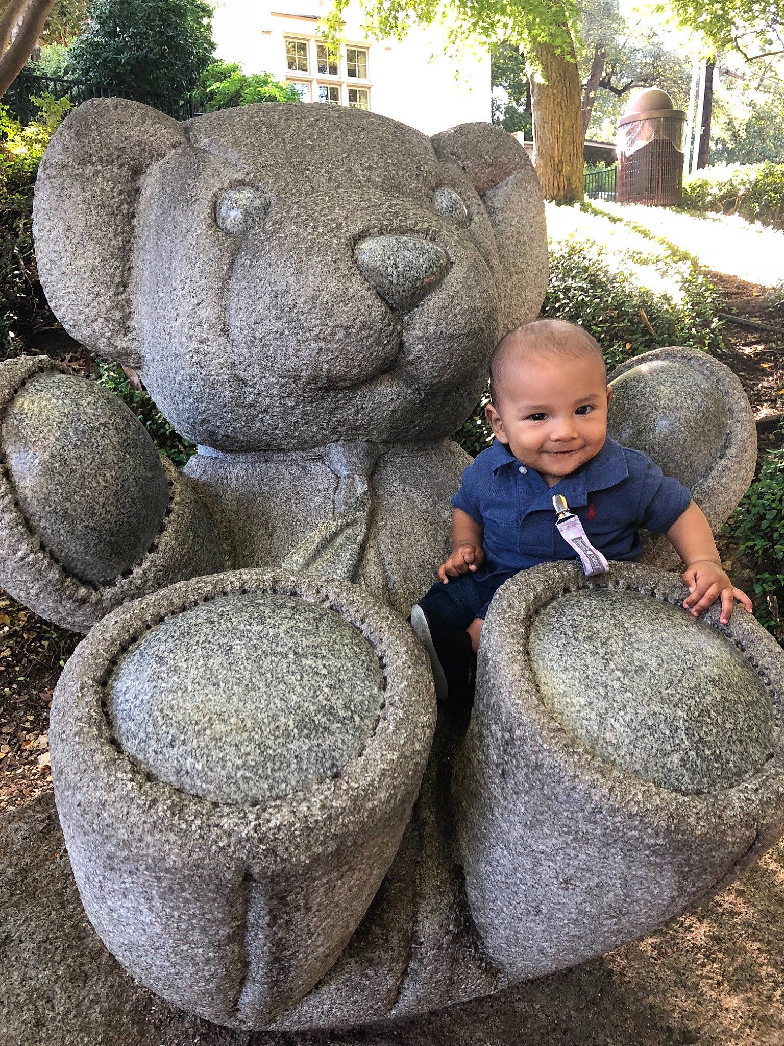 Osias is registered to the contest to win money with this photo: garden, grass, joy, person, plant, rock, sculpture, snout, tree