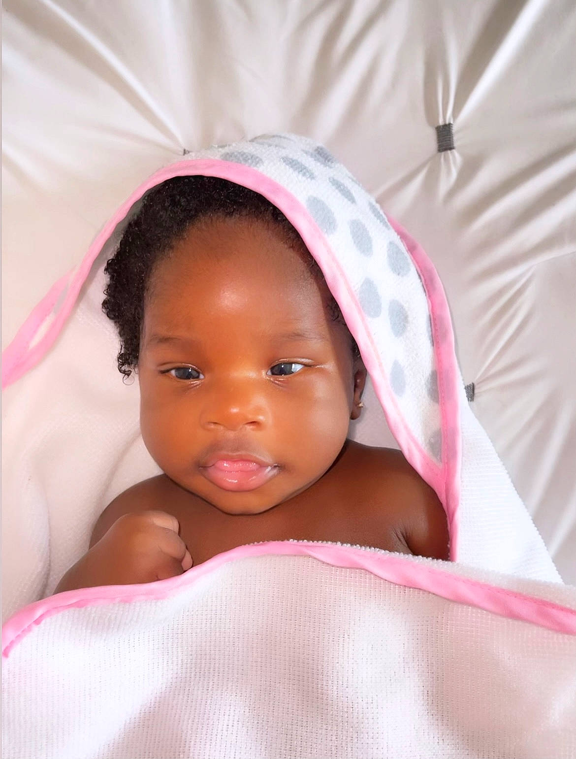 Jordyn is registered to the contest to win money with this photo: baby, cheek, comfort, eye, eyebrow, eyelash, finger, happy, iris, linens, lip, magenta, mouth, neck, nose, person, pink, skin, smile, textile