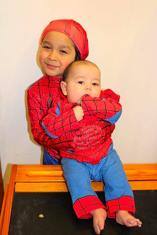 Jonam is registered to the contest to win money with this photo: baby, baby_toddler_clothing, cap, child, event, eye, face, fun, gesture, happy, head, headgear, headwear, human_body, joy, outerwear, pattern, person, plaid, red