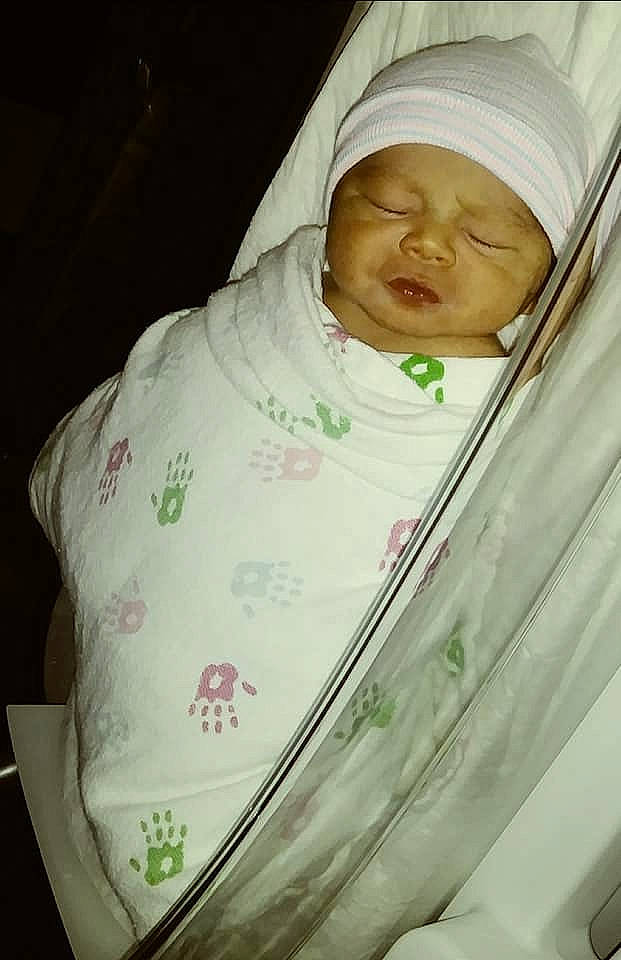 Gadiel is registered to the contest to win money with this photo: baby, baby_products, child, comfort, face, happy, hat, headgear, headwear, human_body, linens, peach, person, room, sleeve, toddler