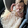 baby, sleeping, car_seat, dress, headband, bow, infant, child, clothing, fabric, seatbelt, car_interior, cute, adorable, peaceful, portrait, soft_light, tulle, young_child, resting