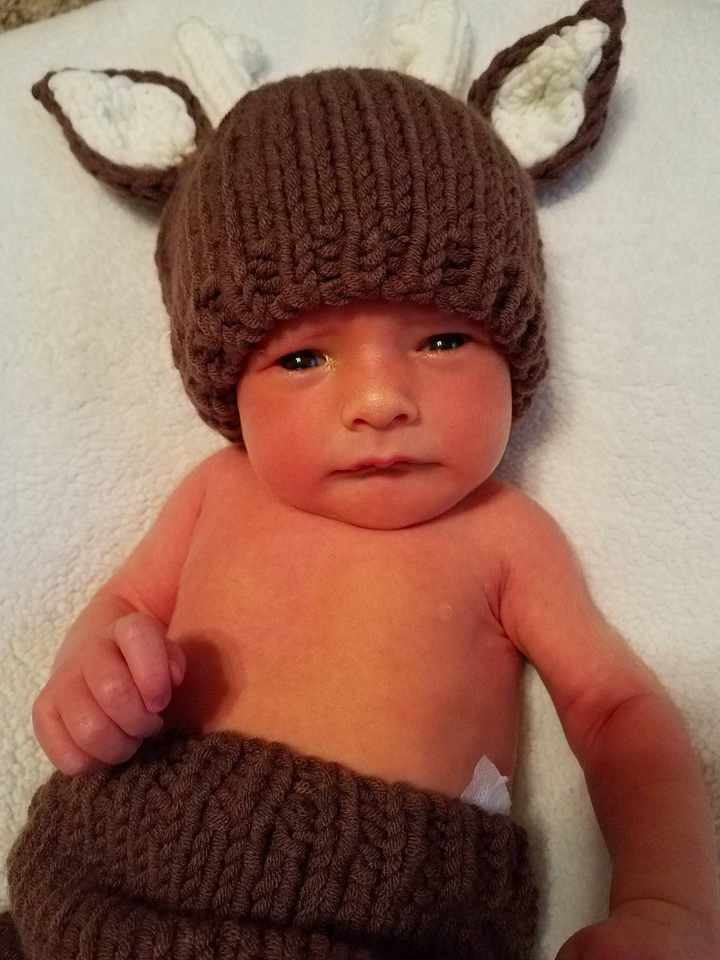 Jaxsen is registered to the contest to win money with this photo: beanie, bonnet, cap, child, crochet, ear, fur, hat, headgear, headwear, infant, knit_cap, knitting, person, toddler, wool