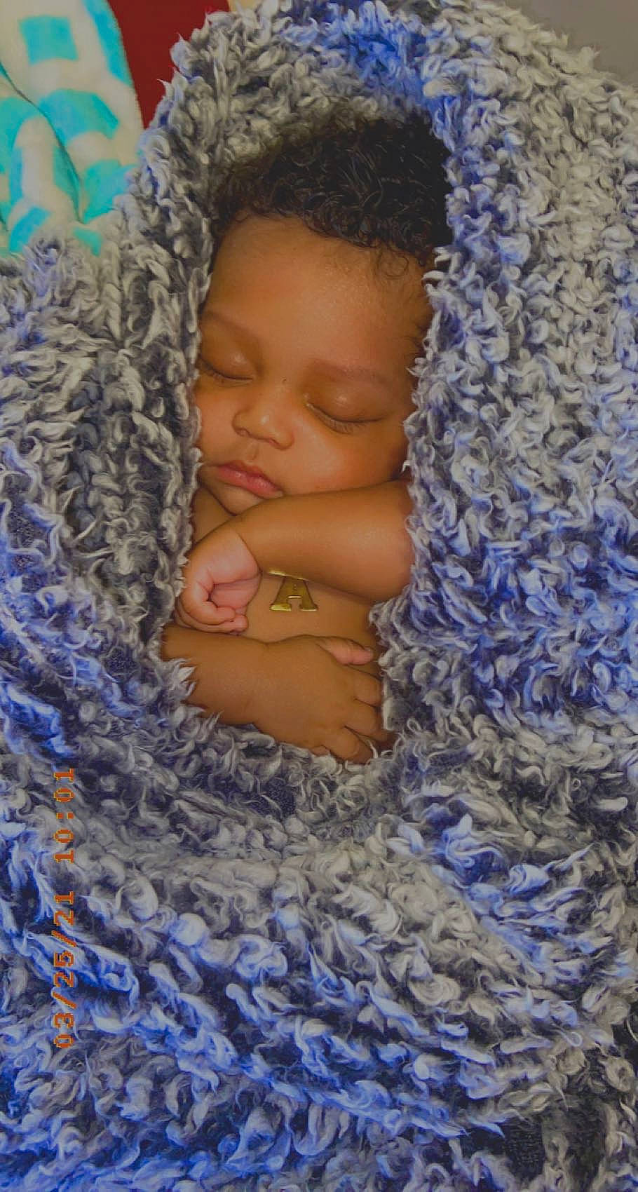 Damari joined the competition — help win amazing prizes! abdomen, azure, baby, blue, chest, electric_blue, event, eye, face, hair, happy, head, linens, pattern, people_in_nature, person, textile, toddler, trunk, wood