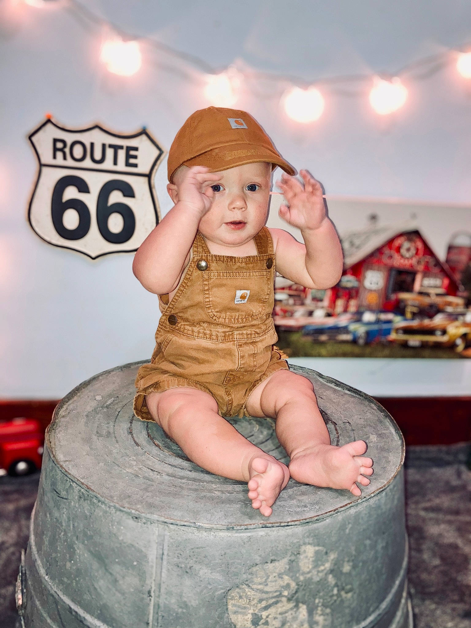 Waylon joined the competition — help win amazing prizes! automotive_tire, child, flash_photography, fun, happy, hat, headwear, human_leg, person, pink, portrait_photography, sitting, tire, vacation