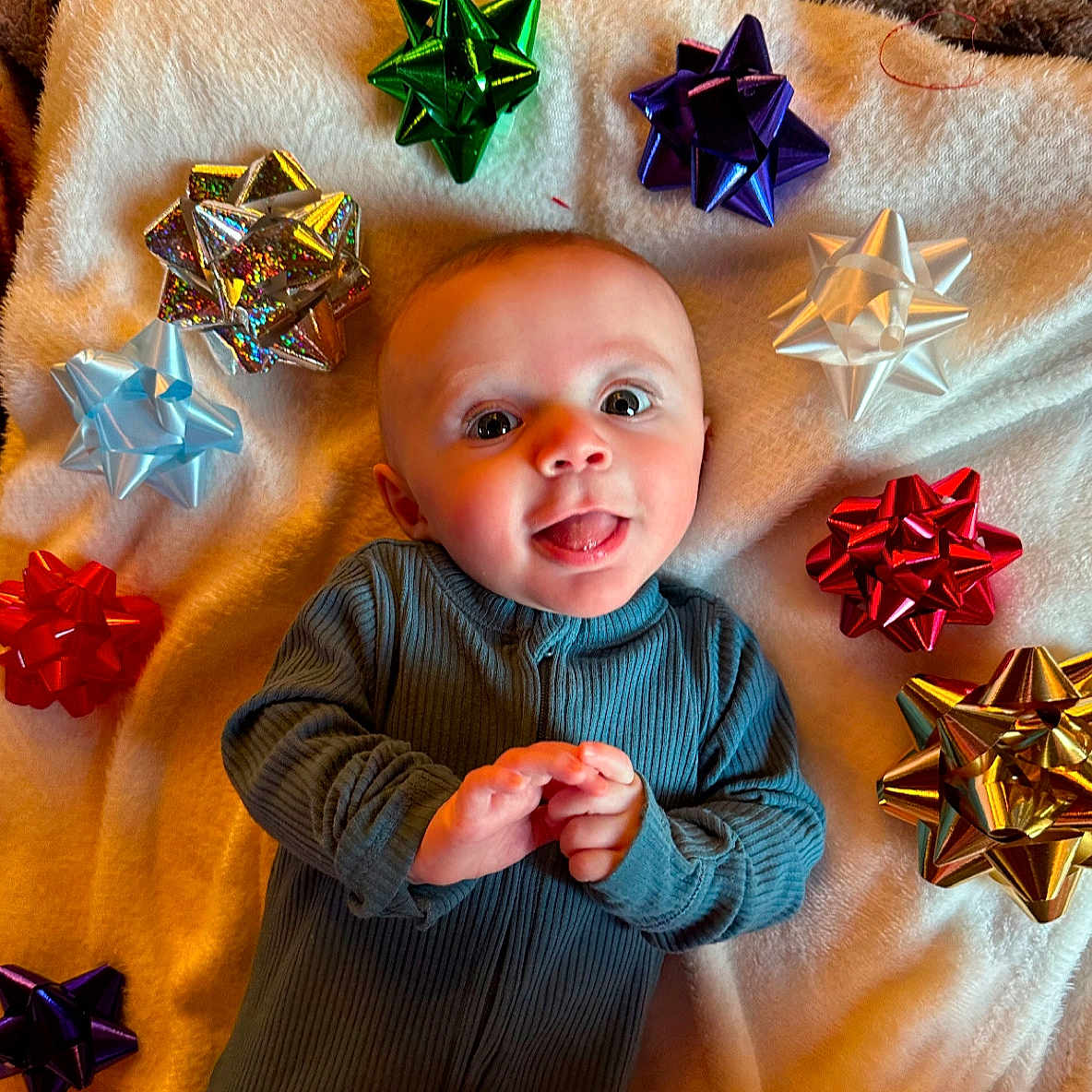 Emmett is registered to the contest to win money with this photo: accessories, art, baby, bodypart, face, finger, food, hand, head, jewelry, origami, paper, person, photography, portrait, quilt, starsymbol, sweets, symbol, toy