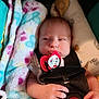 baby, pacifier, car_seat, blanket, hand, infant, straps, clothing, comfort, child, portrait, indoor, cute, resting, young, newborn, soft, colorful, seatbelt, toddler