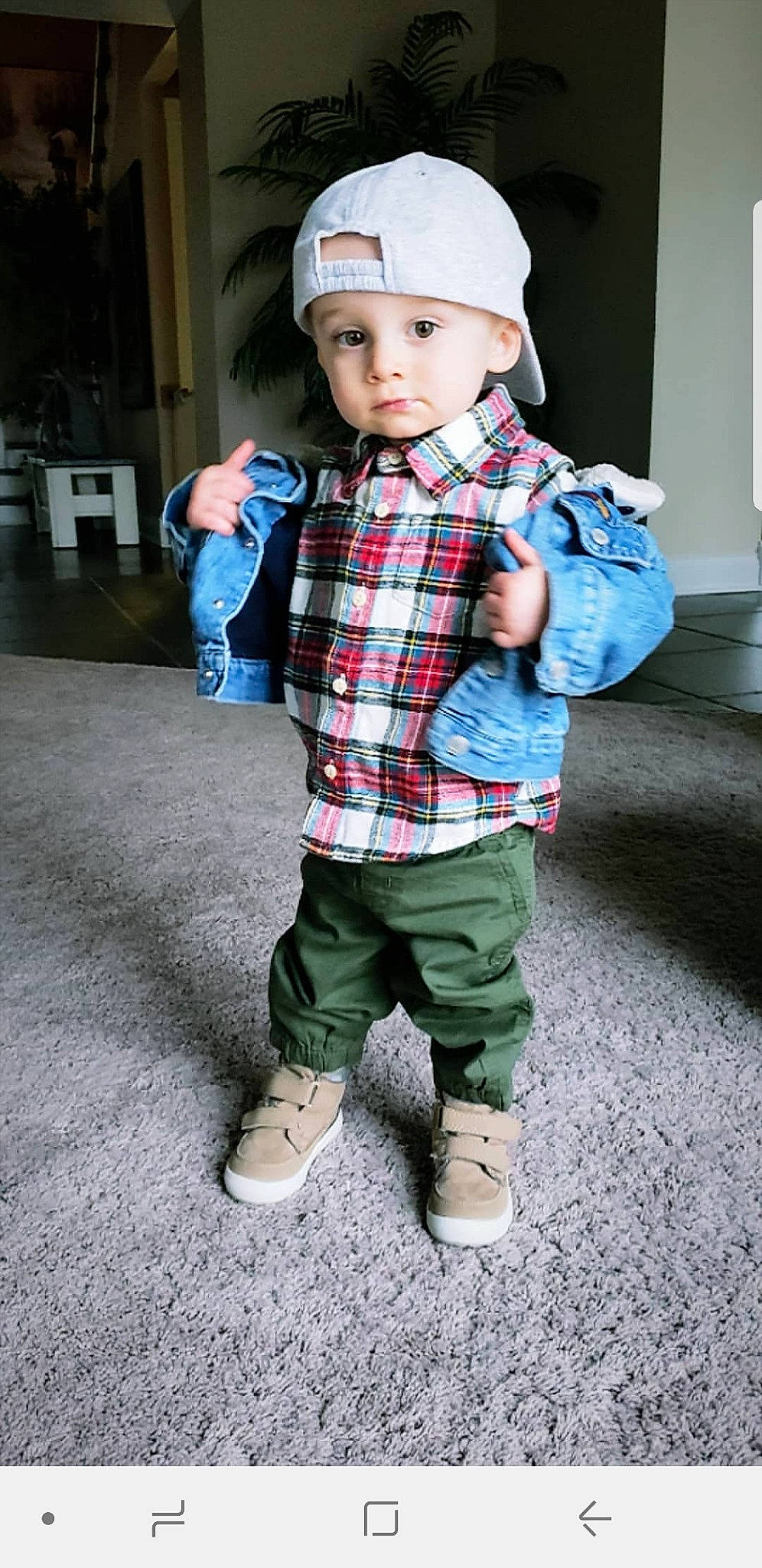 Boone is registered to the contest to win money with this photo: baby, cap, cheek, child, child_model, clothing, cool, denim, design, footwear, headgear, headwear, jeans, male, outerwear, pattern, person, plaid, sleeve, tartan