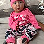 Johanna participe au concours pour gagner de l'argent avec cette photo : baby, bright_colors, child, couch, cozy, cute, expression, floral_pattern, footwear, hat, home, indoors, infant, person, pink_clothing, portrait, sitting, small_hands, soft_toys, young