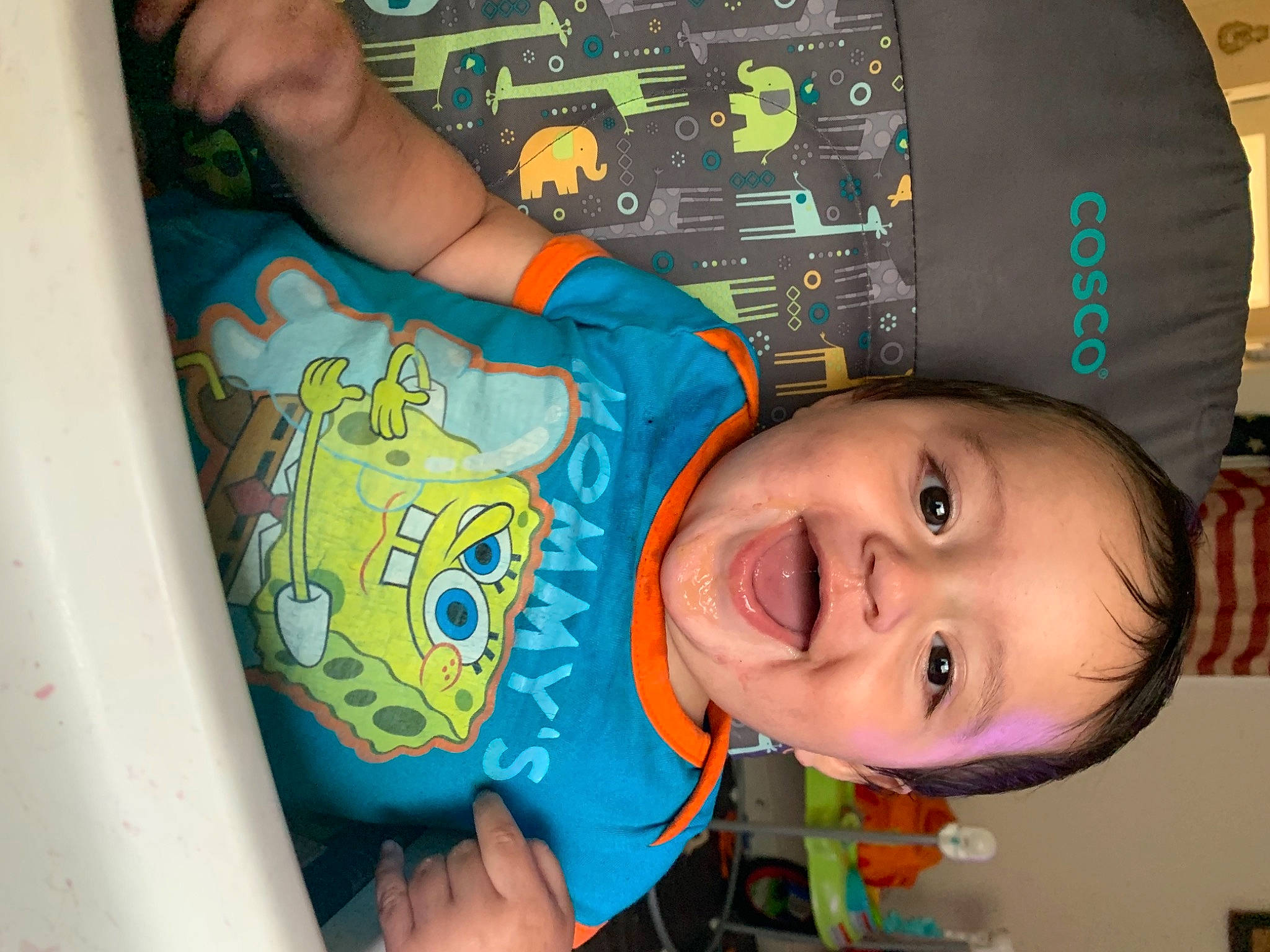 Kaizer is registered to the contest to win money with this photo: baby_laughing, baby_toddler_clothing, chair, child, electric_blue, eye, finger, fun, happy, laugh, logo, mouth, person, room, smile, t_shirt, thumb, toddler