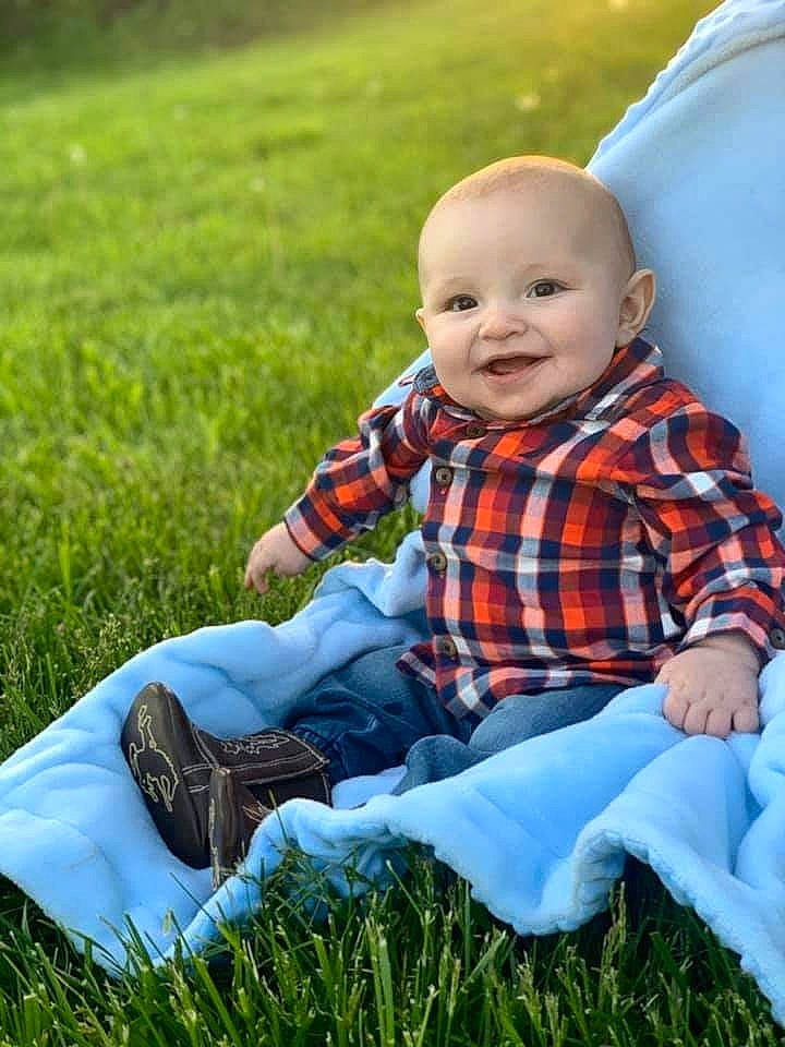Hunter is registered to the contest to win money with this photo: baby, child, grass, grass_family, joy, meadow, pattern, people_in_nature, person, photography, plaid, plant, sitting, skin, toddler