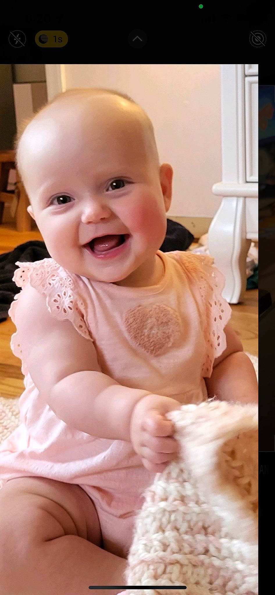 Adelina is registered to the contest to win money with this photo: baby, baby_toddler_clothing, cheek, child, dress, embellishment, event, finger, flooring, fun, happy, headgear, joy, peach, person, pink, sitting, skin, sleeve, smile