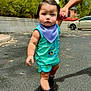 toddler, child, outdoor, asphalt, trees, sunny, hand_holding, car, clothing, sneakers, baby, person, road, sidewalk, greenery, cute, walking, headband, expression, summer