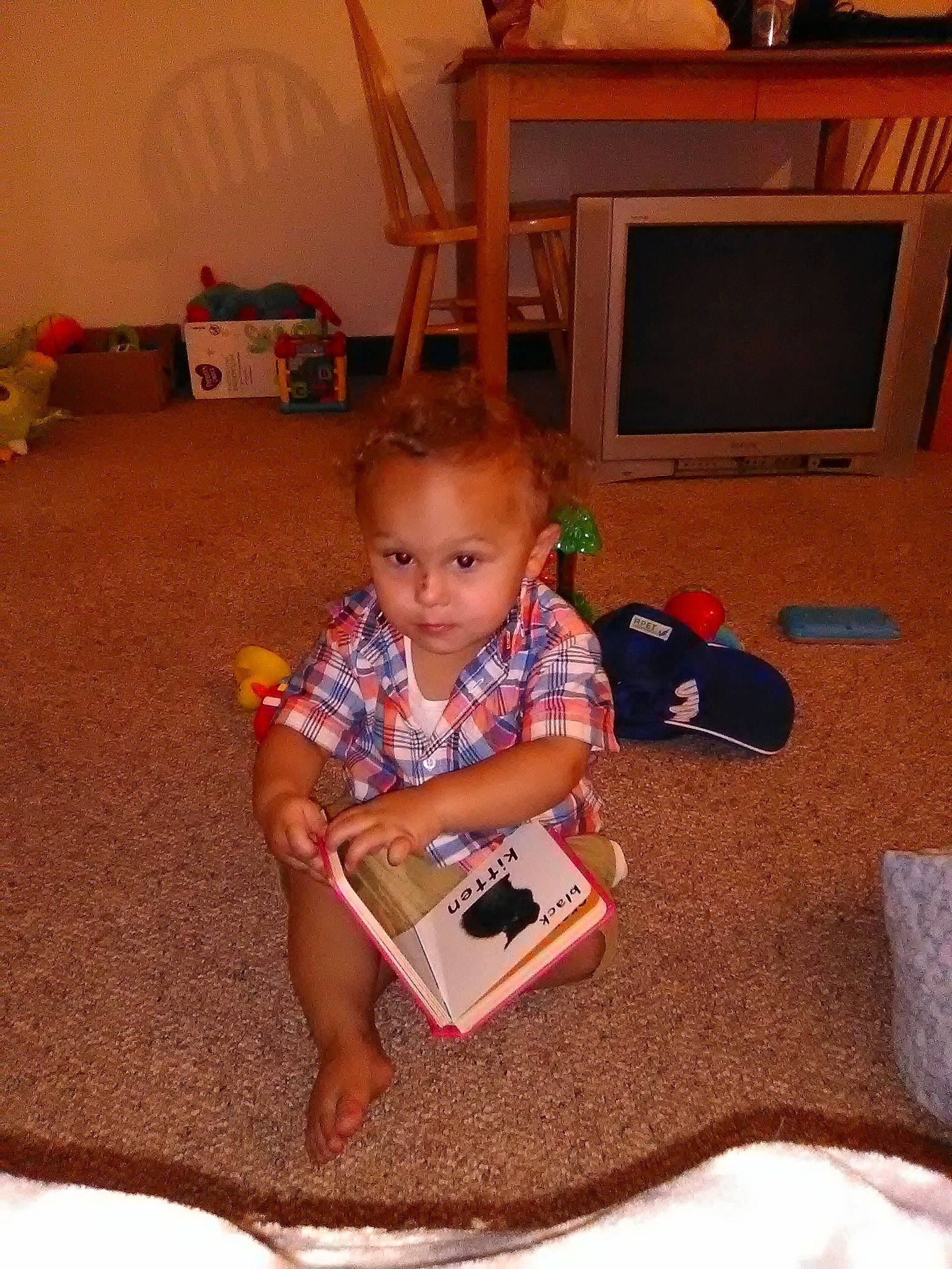 Cade is registered to the contest to win money with this photo: child, electronic_device, person, play, room, sitting, toddler