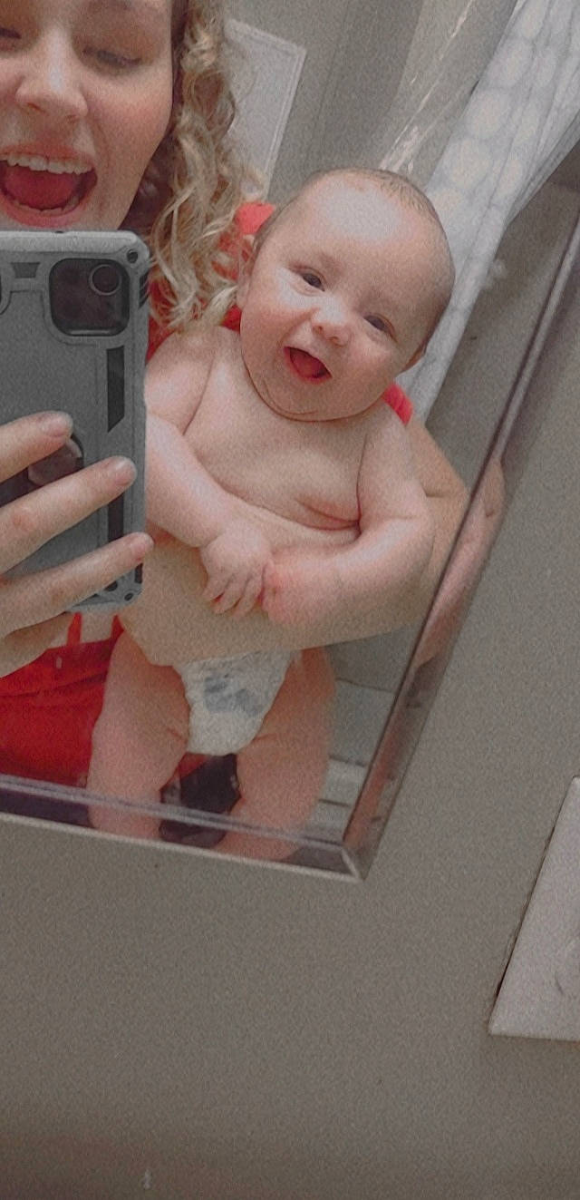 Johnnylee is registered to the contest to win money with this photo: baby, baby_toddler_clothing, camera, camera_lens, cheek, child, chin, communication_device, digital_camera, finger, lip, person, photographer, pink, point_and_shoot_camera, product, single_lens_reflex_camera, skin, smile, thumb