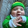 Arthur joined the competition — help win amazing prizes! baby, child, smiling, green_clothing, hat, hands, cheeks, face, closeup, infant, lying_down, blanket, texture, cute, happy, portrait, holiday, festive, clothing, indoor